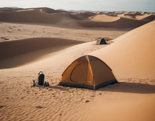 Tent among sand dunes